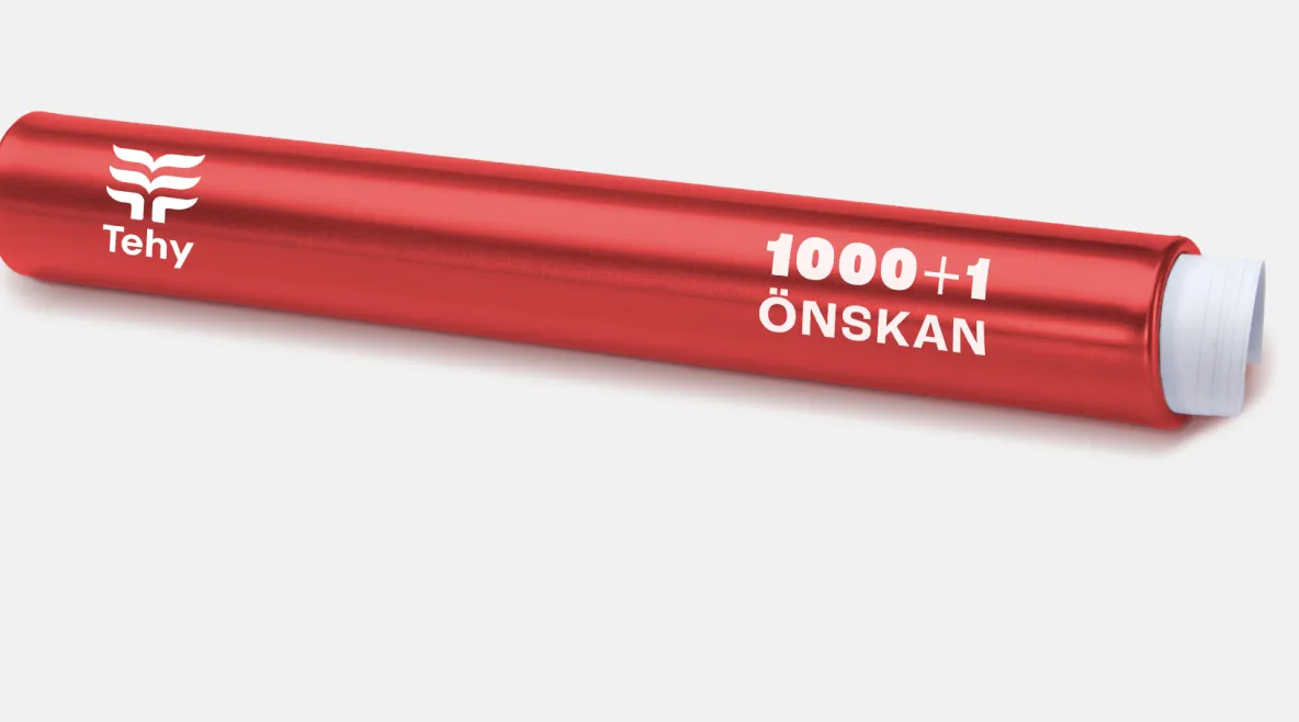 Punainen viestikapula, jonka päällä lukee Tehy tuhat ja yksi toivetta ja sisällä on paperikäärö.. 
