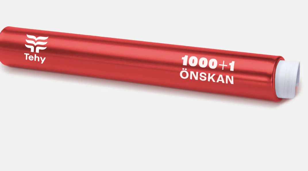 Punainen viestikapula, jonka päällä lukee Tehy tuhat ja yksi toivetta ja sisällä on paperikäärö.. 